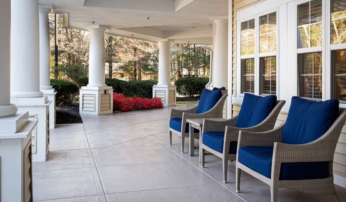 Outdoor seating area with a view of gardens