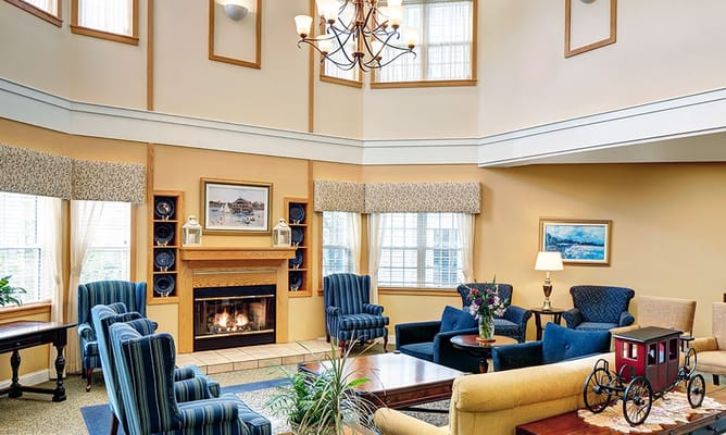 Bright common area with seating and fireplace