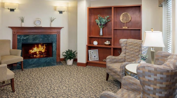 Cozy common area with a fireplace and seating