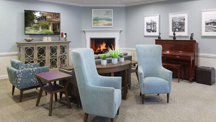 Interior common area with seating and a fireplace