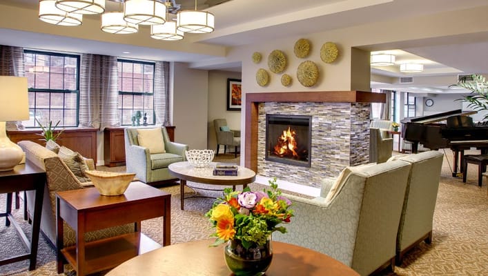 Cozy lounge area with seating and a fireplace