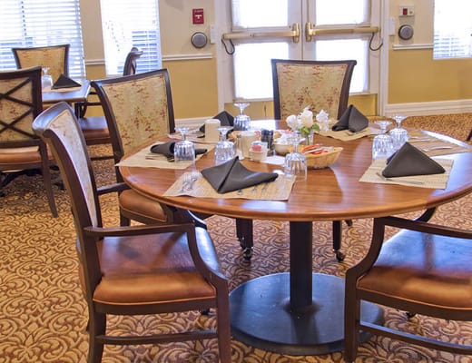 Setting in a dining room with place settings