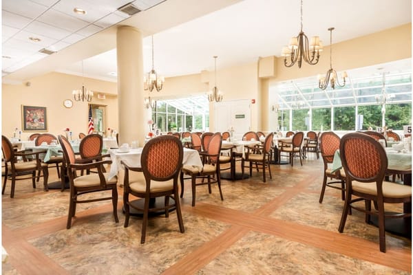 Bright dining room with well-arranged tables and chairs