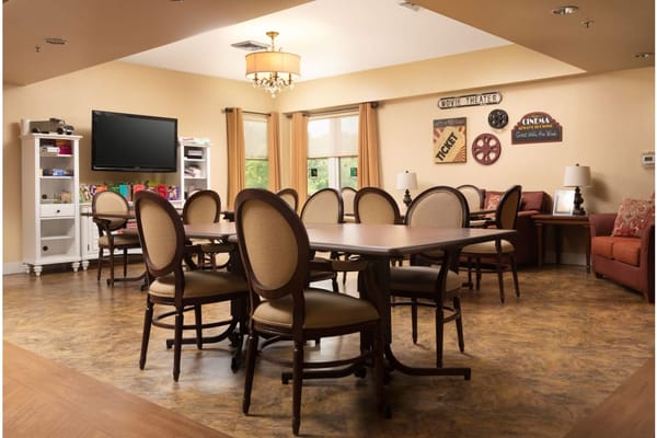 Common area with chairs and decorations for residents