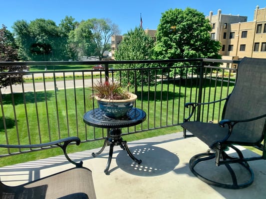 Balcony view with chairs and a garden