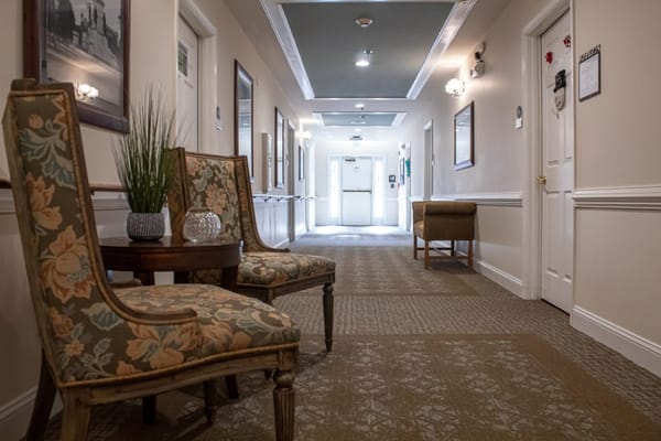 A hallway with chairs and decorative elements