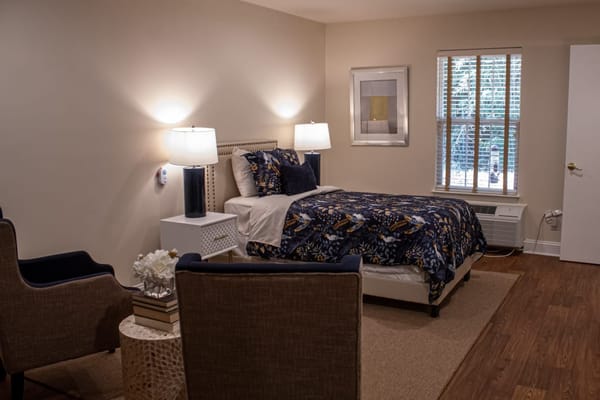 Cozy resident room with bed and seating area