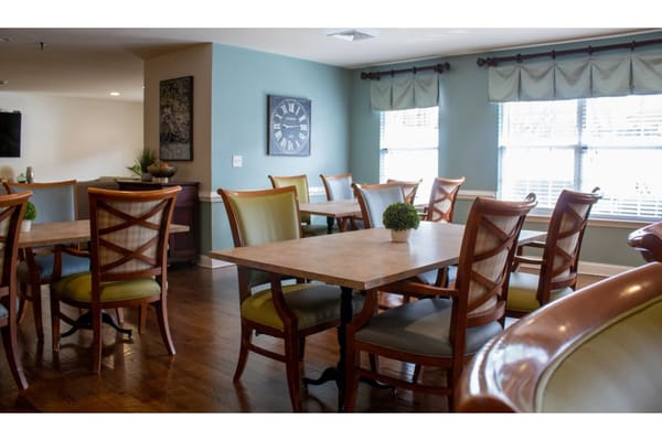 Dining area with wooden tables and chairs
