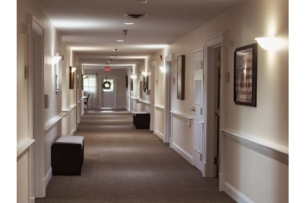 Well-lit hallway in a senior care facility