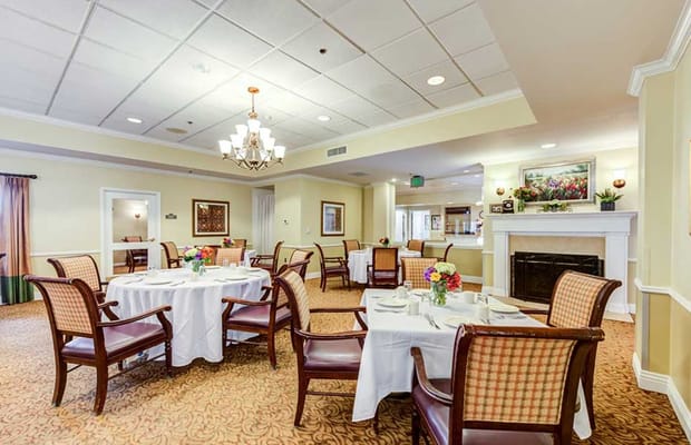 Dining area with tables set up for residents