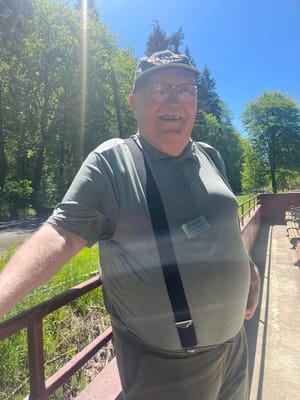 A smiling resident enjoying outdoor space