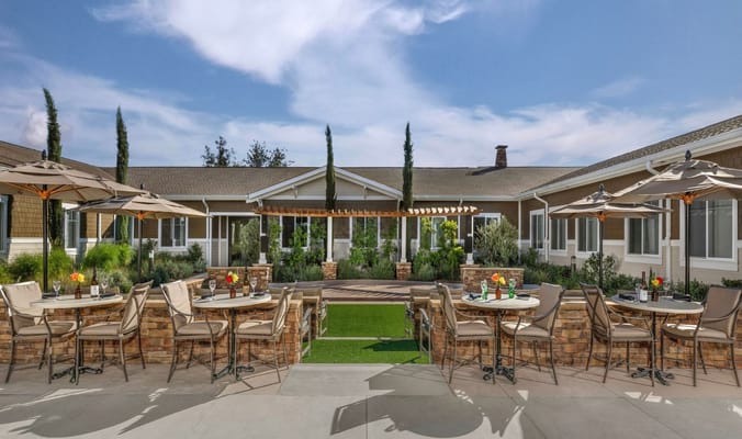 Outdoor dining area with tables and umbrellas