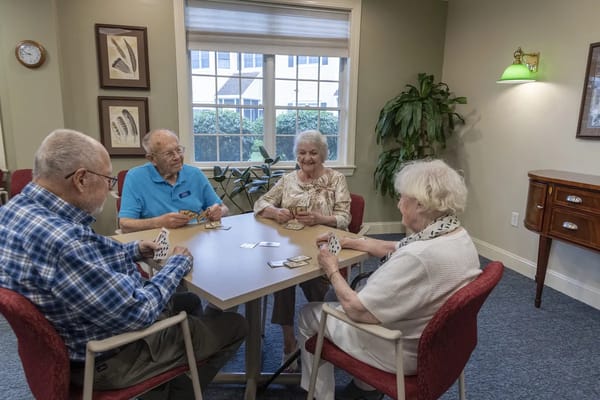 Residents playing cards in a common area