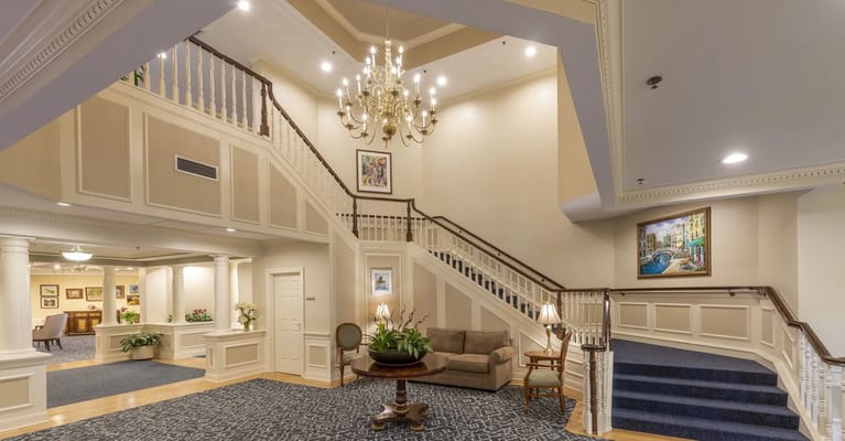 Interior view of a grand lobby with staircase
