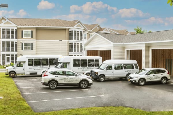 Facility transport vehicles parked in front of building