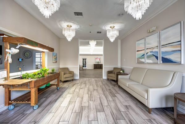 Bright common area with seating and artwork