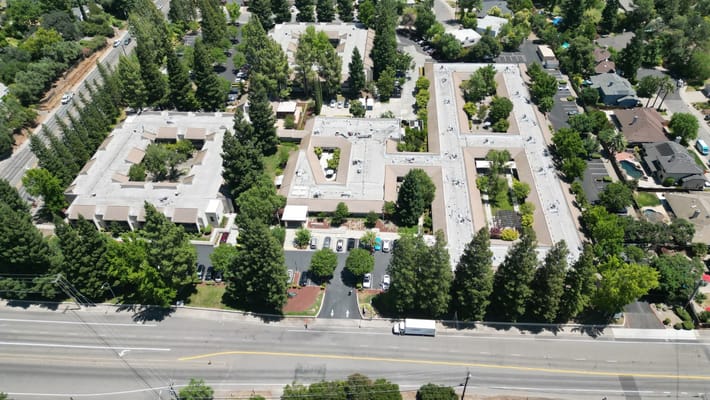 Aerial view of a senior living community with gardens