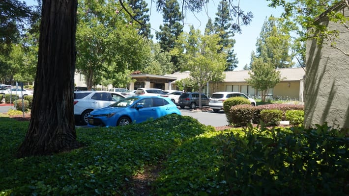 Outdoor view of the facility with vehicles parked