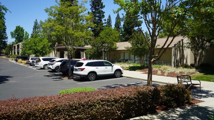 Exterior view of assisted living facility with parking