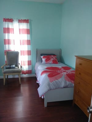 Cozy private resident room with floral bedding