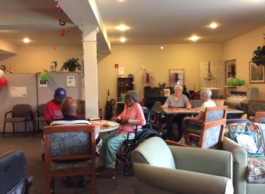 Residents engaged in a social activity in a common area