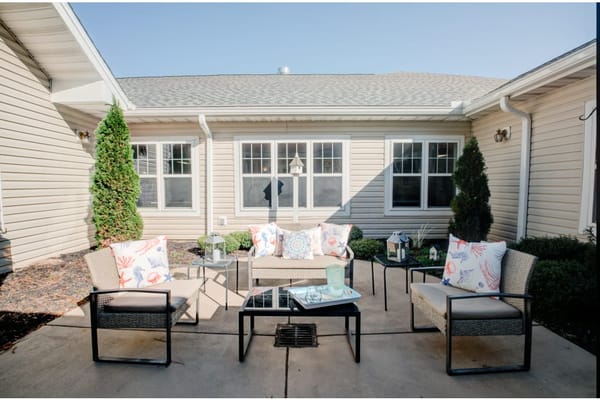 Outdoor seating area with decorative cushions