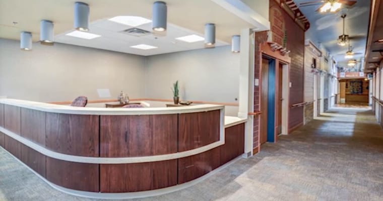 Reception desk in a healthcare facility hallway