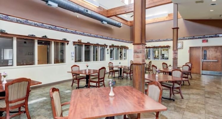 Dining area with wooden tables and chairs