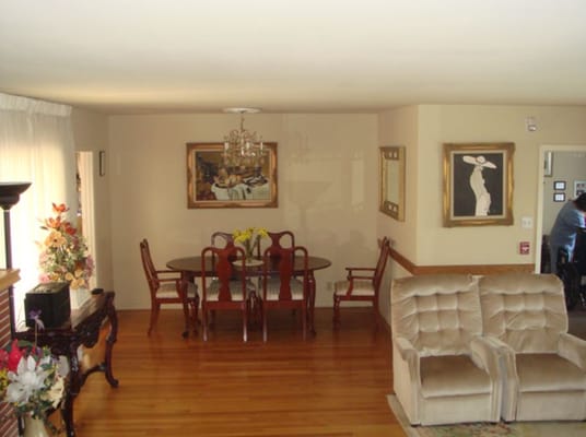 Dining area with a table and chairs in a warm setting