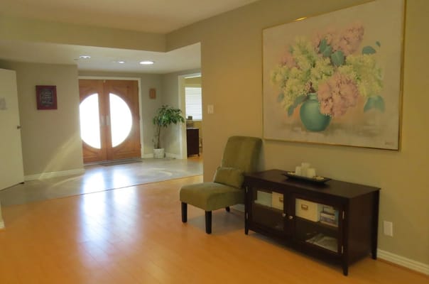 Bright interior of a common area with a floral painting