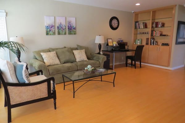 A common area with seating and bookshelves