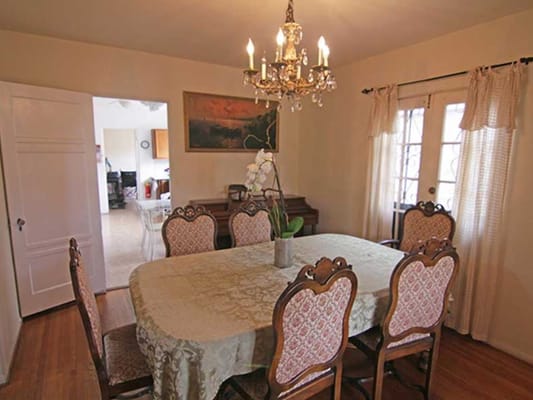 Dining room with a large table and chandelier