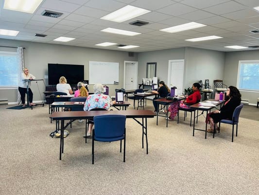 Residents attending a class in an activity room