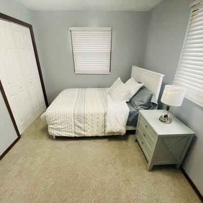 Cozy bedroom with a bed and bedside table