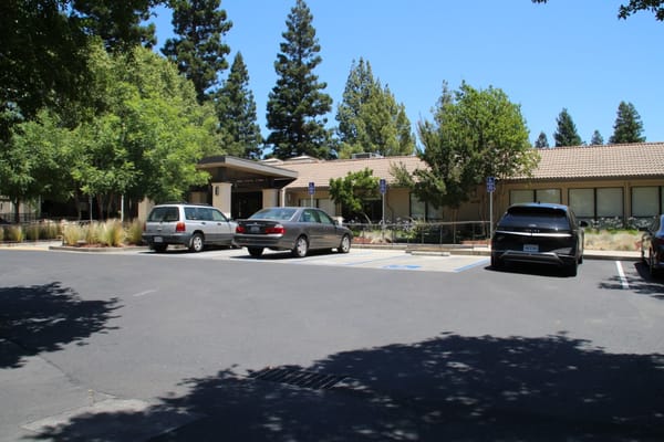 Exterior view of the assisted living facility with parking