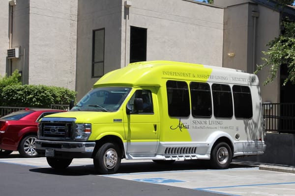Facility transportation van parked in front of building