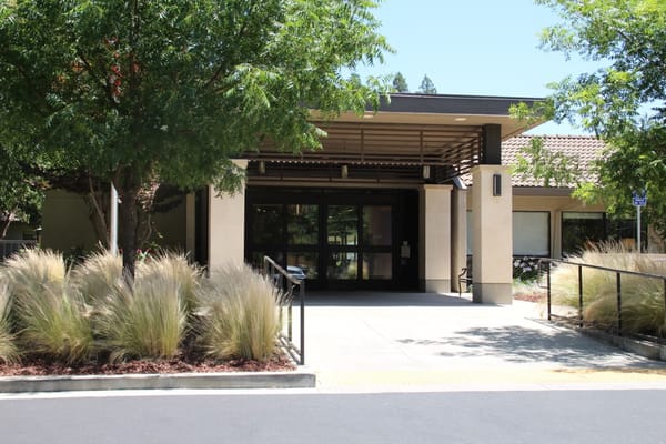 Entrance of a senior living facility with landscaping