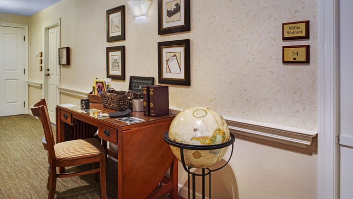 Cozy interior hallway with desk and globe decoration