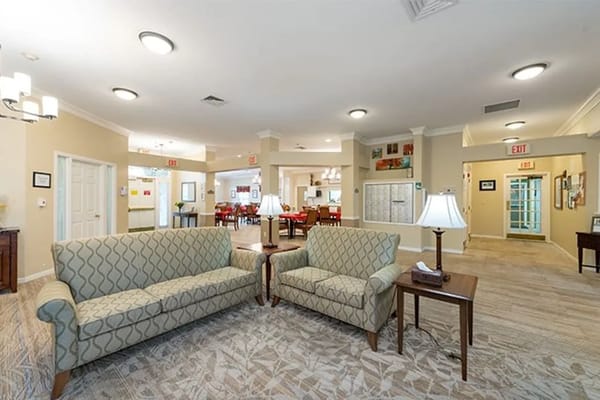 Bright lobby area with seating and dining visible