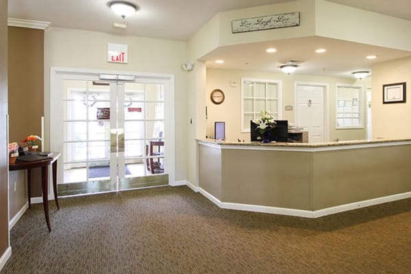 Welcoming lobby space with reception desk at Lake House Kalamazoo.