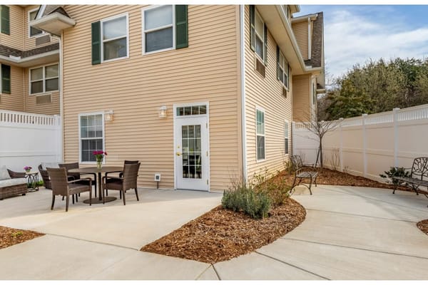 Outdoor seating area with tables and chairs