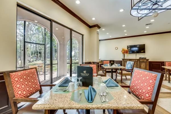 Bright dining area with tables set for meals