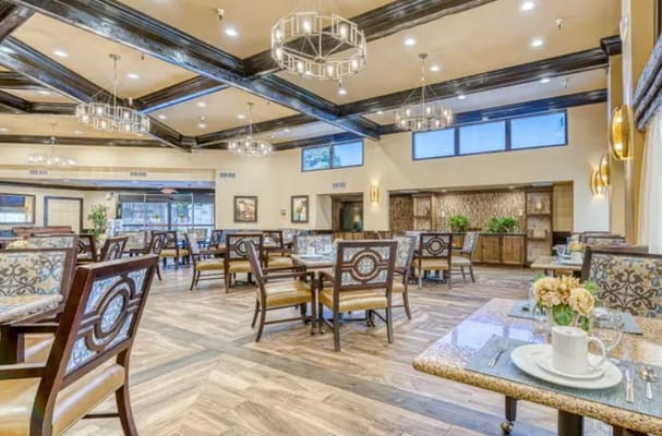 Spacious dining room with wooden beams and elegant seating