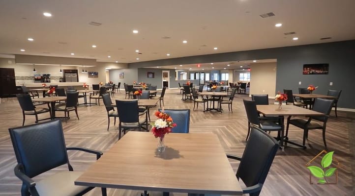 Spacious dining area with tables and floral arrangements