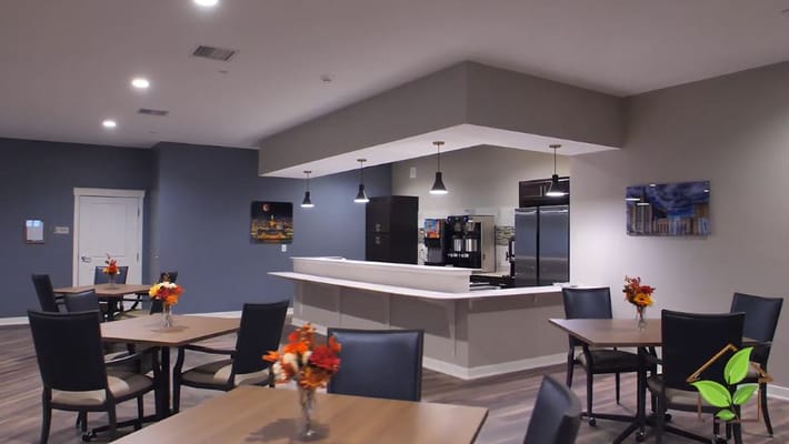 Bright dining area with tables and decorative flowers