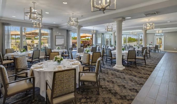 Bright dining room with elegantly set tables