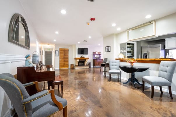 Interior common area with seating and a piano