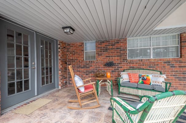 Outdoor seating area with chairs and table