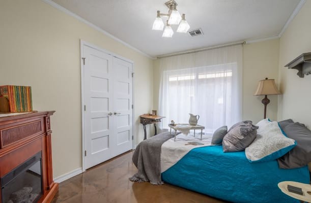 Cozy private resident room with a bed and decor