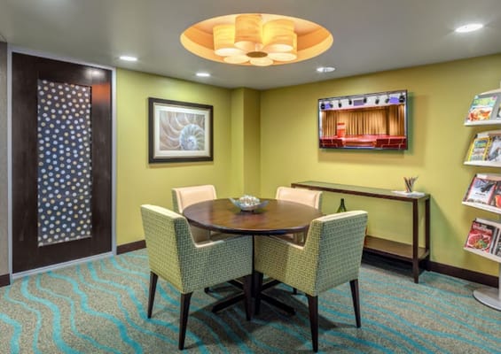 Cozy common area with a round table and light fixtures